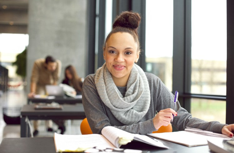 Latin student studying in the library. 